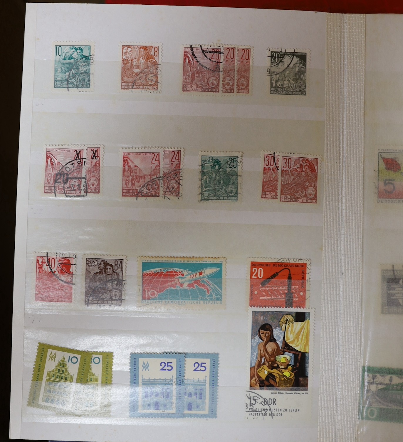 Four stock books of British stamps, QEII mint unused definitives and stamp books, some pre-decimal and two stock books of DDR used and mint unused stamps